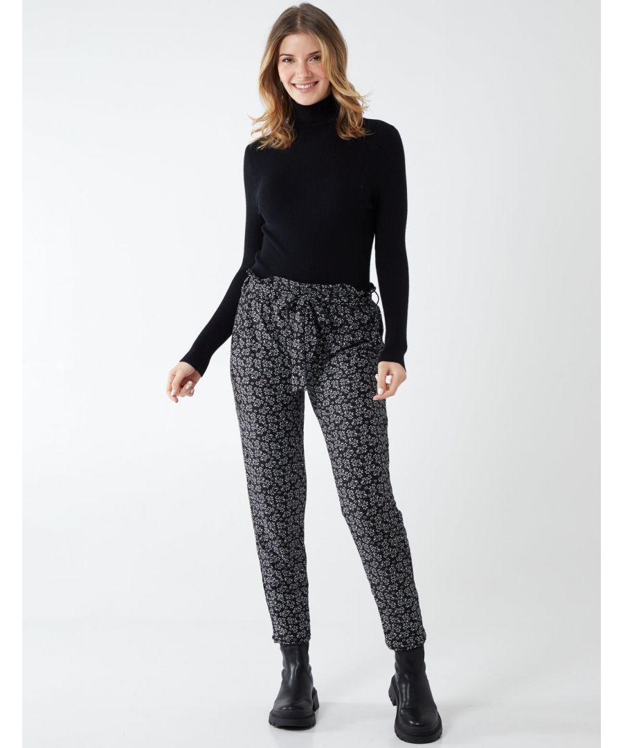 This garment is the perfect addition to your winter collection. The soft touch and paperbag waist detail makes these trousers look super cozy. Wear casually with a white T shirt.\n90% Polyester, 10% Elastane. Machine washable. Approx length 92 cm. Unfastened. Model wears size 8. Model height: 5'9