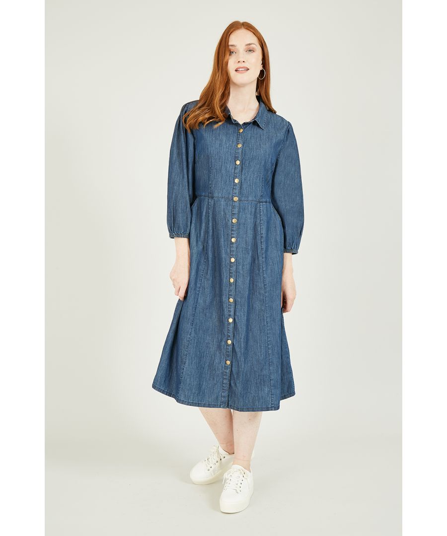Update your day dress collection with this chic, demin-look Yumi Chambray Shirt Dress With Puff Sleeves. A unique piece with a shirt style collar, brassy popper buttons, fitted waist and 3/4 elasticated puff sleeves. Match with suede ankle boots to complete the look.