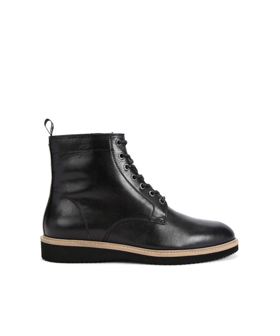 The Donald ankle boot arrives in a black leather with a classic lace up front. There is a metal branded plate on the laces ass well as KG Kurt Geiger logo printed on ribbed textile with a print stitch detailing at the ankle.
