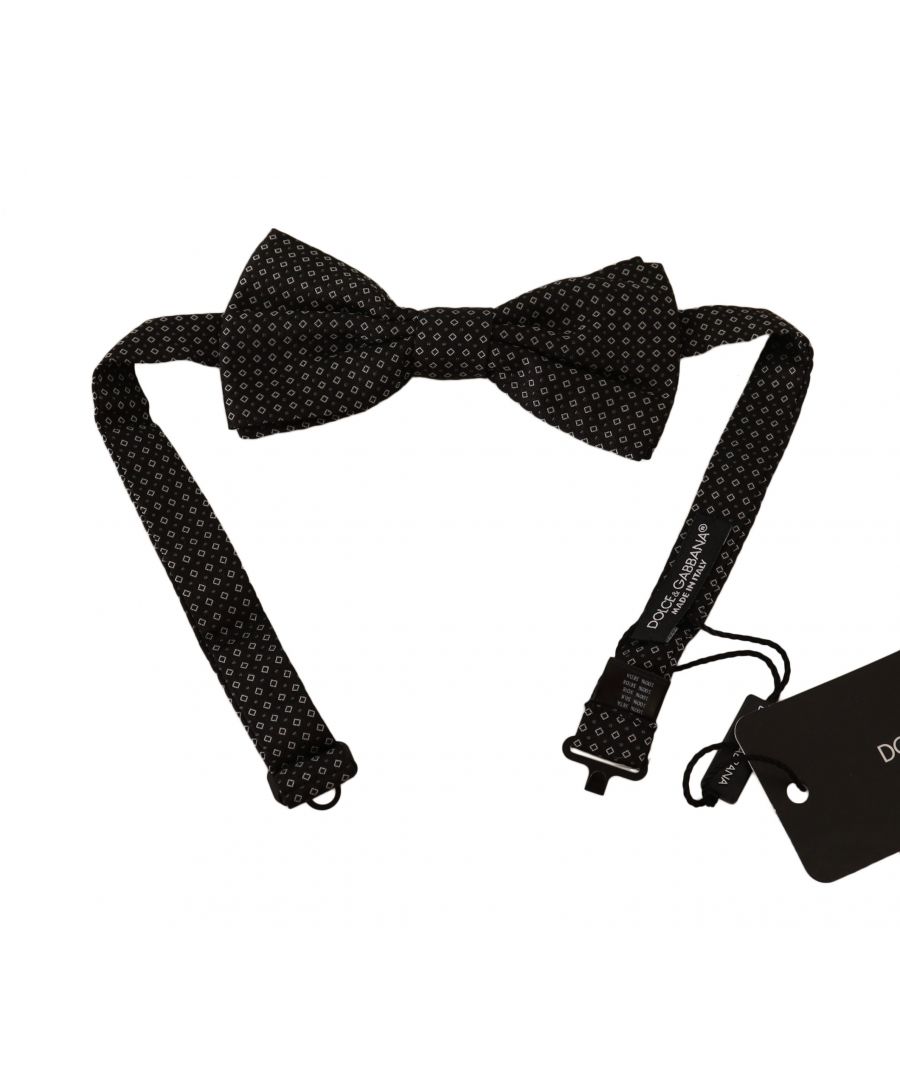 DOLCE & GABBANA\n\nAbsolutely stunning, 100% Authentic, brand new with tags Dolce & Gabbana bow tie. The masters of the brand added a small metal clasp in the form of a hook on the back of the model.\n This item comes from the exclusive Dolce & Gabbana collection.\nColor: Black with pattern\nModel: Tied\nMaterial: 100% Silk\nAdjustable length neck strap, one size\nMade In Italy