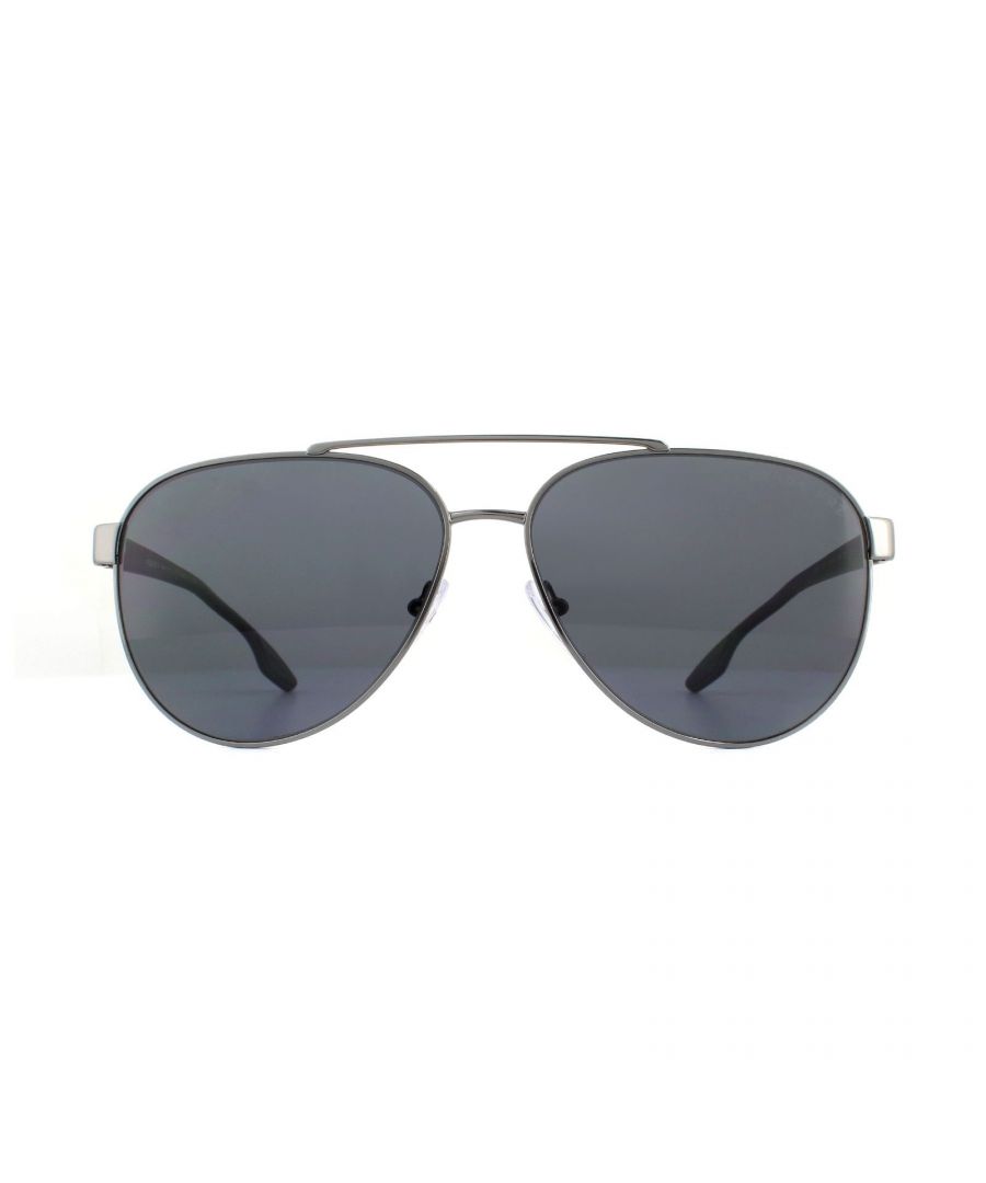 Prada Sport Sunglasses PS54TS 5AV5Z1 Gunmetal Grey Polarized are Italian made classic metal aviator style sunglasses featuring a very fine brow bar. The slimline temples are made from plastic, have rubber inserts at the temple tips for grip and feature the iconic red branded detailing at the hinges.
