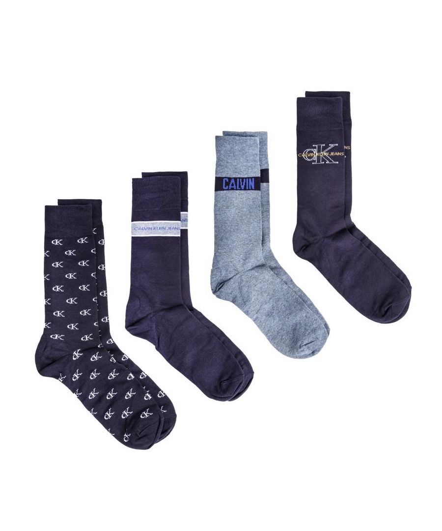 Mens multi Calvin Klein four pack combo socks, manufactured with cotton. Featuring: woven branding, cotton cushion crew, presentation tin, four design and one size.