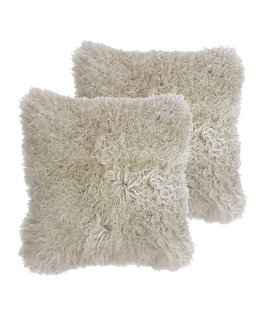 Irresistibly gorgeous the mongolian cushion cover is an absolute dream to own. Washed fur in subtle colours is a trending fabric and can be found in the homes of some of the most influential people. Made from 100% natural sheepskin fur you'll be running your hands through its softness for years to come. The face of this cushion has a deep pile, fur front in a range of soft pastel colours while the reverse is made of soft faux suede in colour-coordinated tones. Complete with knife edging and a zip closure, concealed with a strip of fabric, this cushion is unbelievably cosy and will work perfectly on sofas and beds. Versatile and adaptable this cushion cover can be worked into a range of interiors such as a minimalist bedroom display or to add a soft touch to a leather sofa. Please note fur texture ranges and may appear curlier or straighter to image. To ensure this cushion will last for years to come treat it carefully and dry clean only. Do not iron and lay flat to dry for the best results.