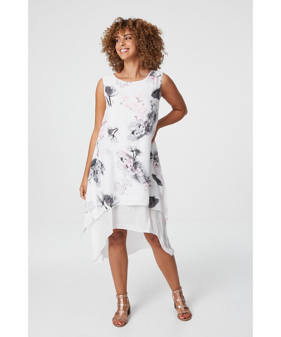 Add a lightweight comfortable tunic dress to your closet with this floral printed dress. With a round neck, a sleeveless fit, a loose swing fit and a layered hanky hem sitting below the knee. Pair with sandals for a sunshine friendly look or layer over jeans for a versatile everyday outfit
