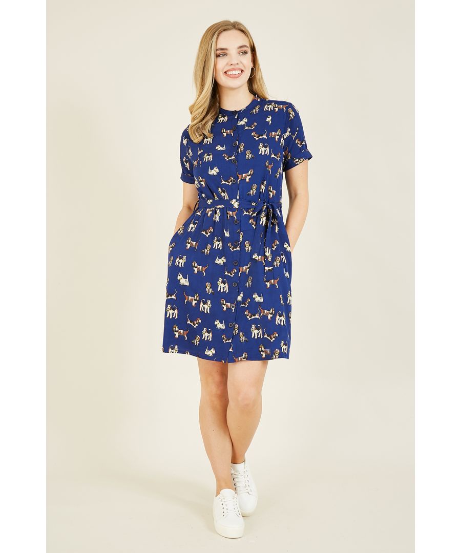 Featuring deep pockets, an on-trend grandad collar and a classic shirt cut, this Yumi Navy Dog Print Recycled Shirt Dress is covered in a super cute, Yumi designed dog print. Sustainable as well as stylish, this dress is crafted from recycled material. Perfect layered over tights.