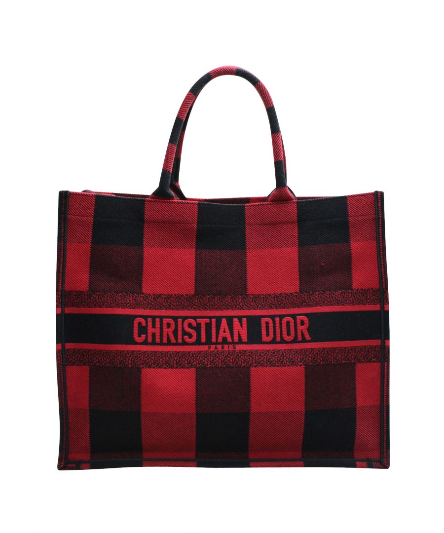 VINTAGE, RRP AS NEW\nDesigned by Maria Grazia Chiuri, the Dior Book Tote is a travel accessory for people with style. The bag here is crafted from canvas into a beautiful structure and covered in plaid patterns all over. Two handles, the 'Christian Dior' signature, and a spacious interior complete the tote. A stylish bag for elegant women.\n\nDior Plaid Book Tote Bag in Red Canvas\nCondition: excellent, with dust bag\nSign of wear: No\nSKU: 116587   \nColor: red\nMaterial: canvas\nSize: one size