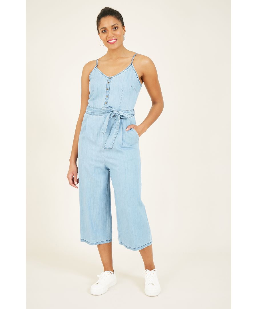 Crafted from pure, 100% cotton, our Yumi Denim Lightwash Jumpsuit is cool, calm and carefree. Featuring cute button up detailing, large pockets, a statement waist belt and a flattering wide leg, this piece is all about looking and feeling great. Pair with white trainers or dress it up with barely there heels for a night on the town. As suited to a relaxed summers night as it is to layering in colder months, this is the perfect versatile addition to your wardrobe.  100% Cotton Machine Wash At 30 Length is 114cm-44.8inches