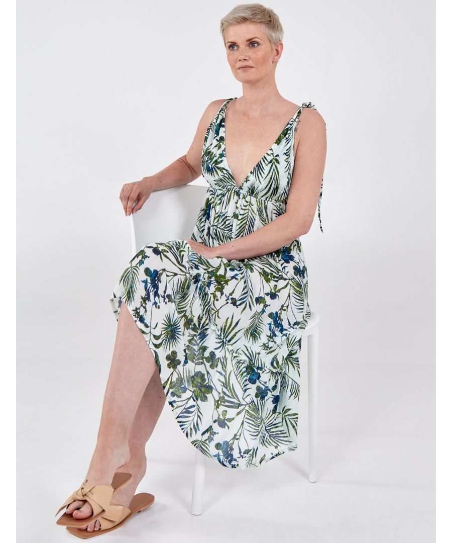 Go for the tropical look in this bold and vibrant leaf design dress. Featuring a gorgeous low v-neckline and and back. Finish off the look with wedges for the perfect getaway.