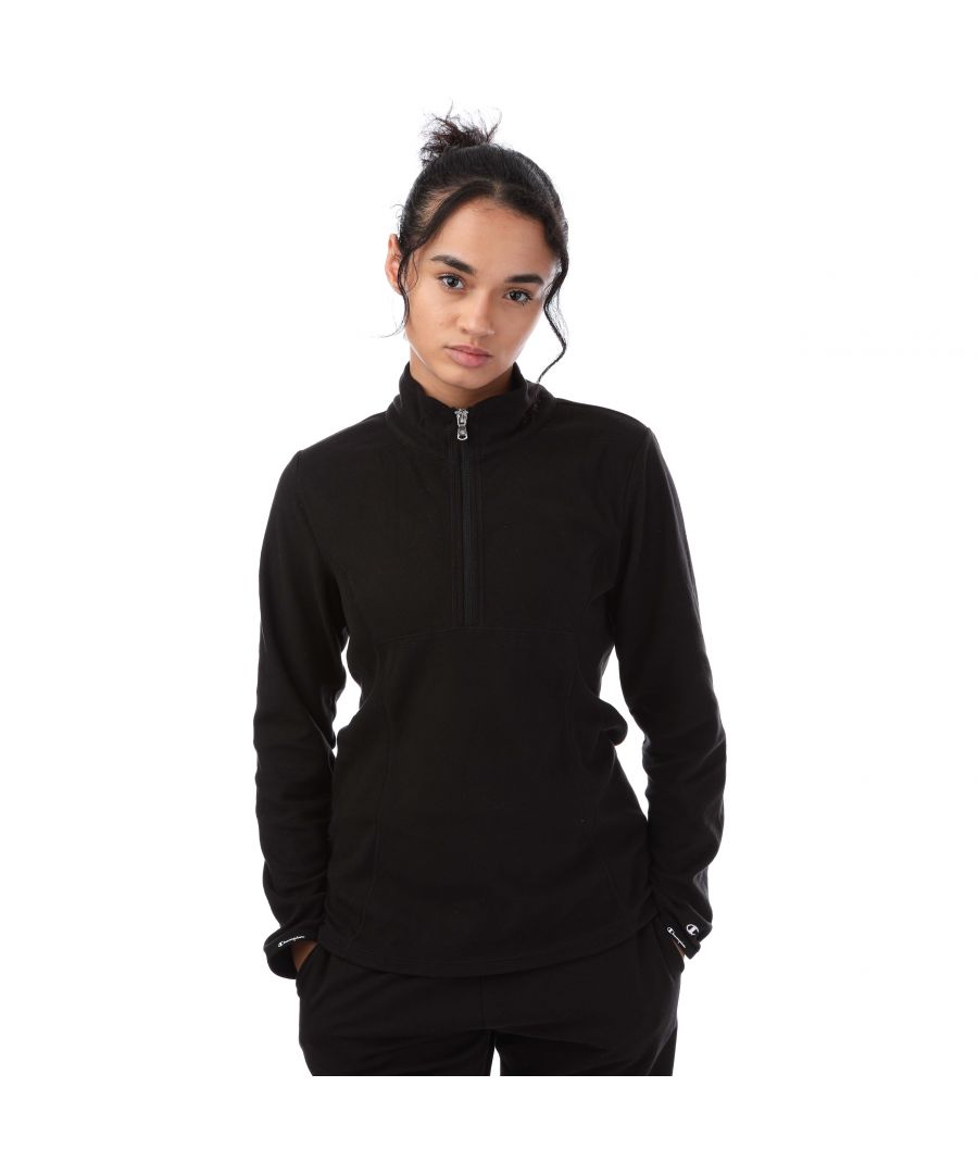 Womens Champion Half Zip Micro Polar Fleece Top in black.- Half zip-up design with stand up collar.- Long sleeves.- C logo embroidered at left cuff.- Branded stretch binding trim at cuffs.- Soft and lightweight micro polar fleece.- Athletic fit.- Body: 100% Polyester.  Machine washable.- Ref: 112123KK001