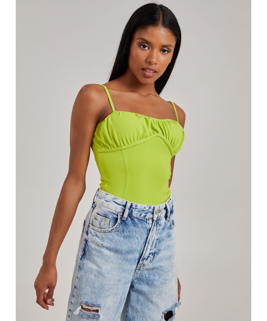 Get summer ready with this corset seam bodysuit. Add this to any 'fit for an instant, effortless outfit that is sure to make you standout. 95% Polyester, 5% ElastaneMade in UKWash With Similar ColoursIron On ReverseDo Not Dry CleanModel wearing size 6Model height: 5â€™5 / 165cm