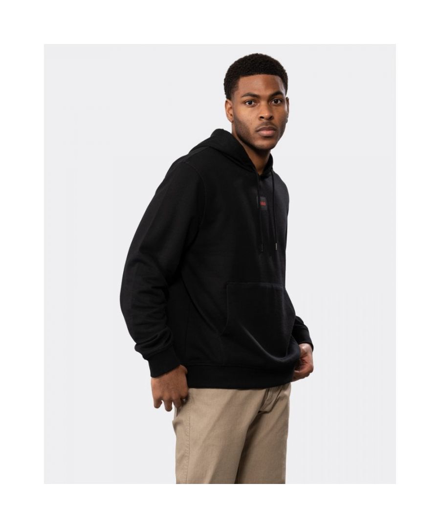 A hooded sweatshirt cut to a regular fit, by HUGO Menswear. Trimmed with a branded label in signature red at the centre chest, this hoodie is crafted in French terry cotton for cosy comfort. A kangaroo pocket and ribbed trims add the finishing touches. HUGO is created for those who lead rather than follow. We work continually to reduce our environmental impact, in order to help protect our planet. Purchasing this item helps HUGO to support the Cotton made in Africa initiative.\nRegular fitHoodedPockets top: Kangaroo pocketLong sleevesRibbed cuffs\n100% Cotton, Lining: 100% Cotton\n50458700