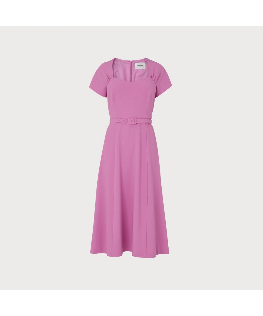 With a beautiful 1940s-inspired neckline, our Emmy dress is full of vintage charm. Crafted from lilac crepe - one of our key colours this season - it has a sweetheart neckline with pleat detail, short sleeves, a skinny buckle belt, contrast pink lining and a flared midi skirt. Play to its vintage look by wearing with a sleek pair of courts and cat eye sunglasses.