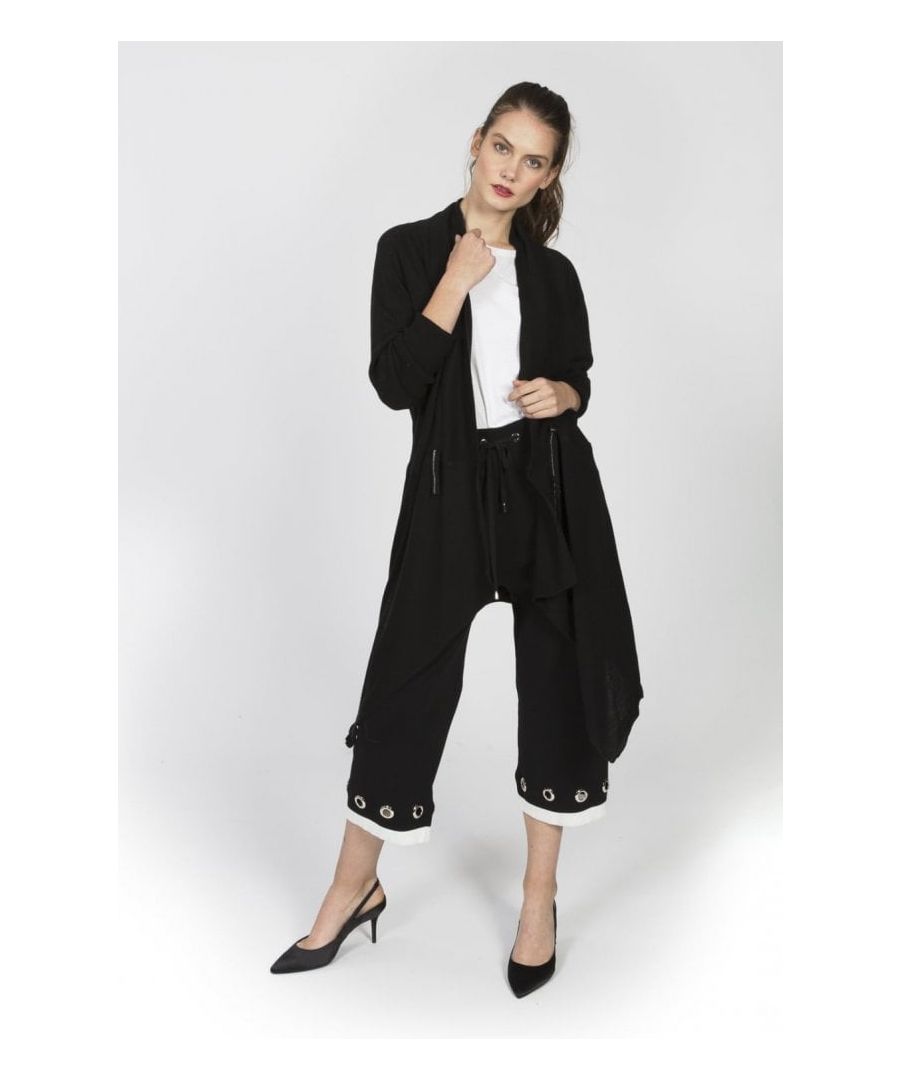 Model Wearing: One Size\n\nAn exceptional cashmere cardigan with rolling lapels and flared side seams adding femininity to the silhouette of the item.