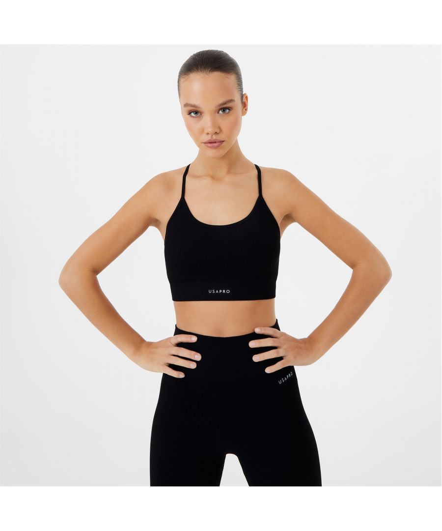 Stay sporty and classic in this USA PRO ribbed sports bra. Active inspired in the front and party in the back, add instant impact to your routine. Did we mention that it's pro-dry wicking sweat away as well as being seamless, creating that flawless finish on any figure? This exercise essential will soon become your new favourite. > Seamless > Pro-dry > Scoop neckline > Ribbed fabric > Signature branding > Strappy back detail > 67% nylon, 23% polyester, 10% elastane > Machine washable > Style: Low Impact Sports Bras > Material Technology: Pro-Dry > Fastenings: Pull Over > Strap Type: Multiway Straps > Cup Style: Seamless > Care Instructions: Follow Care Instructions