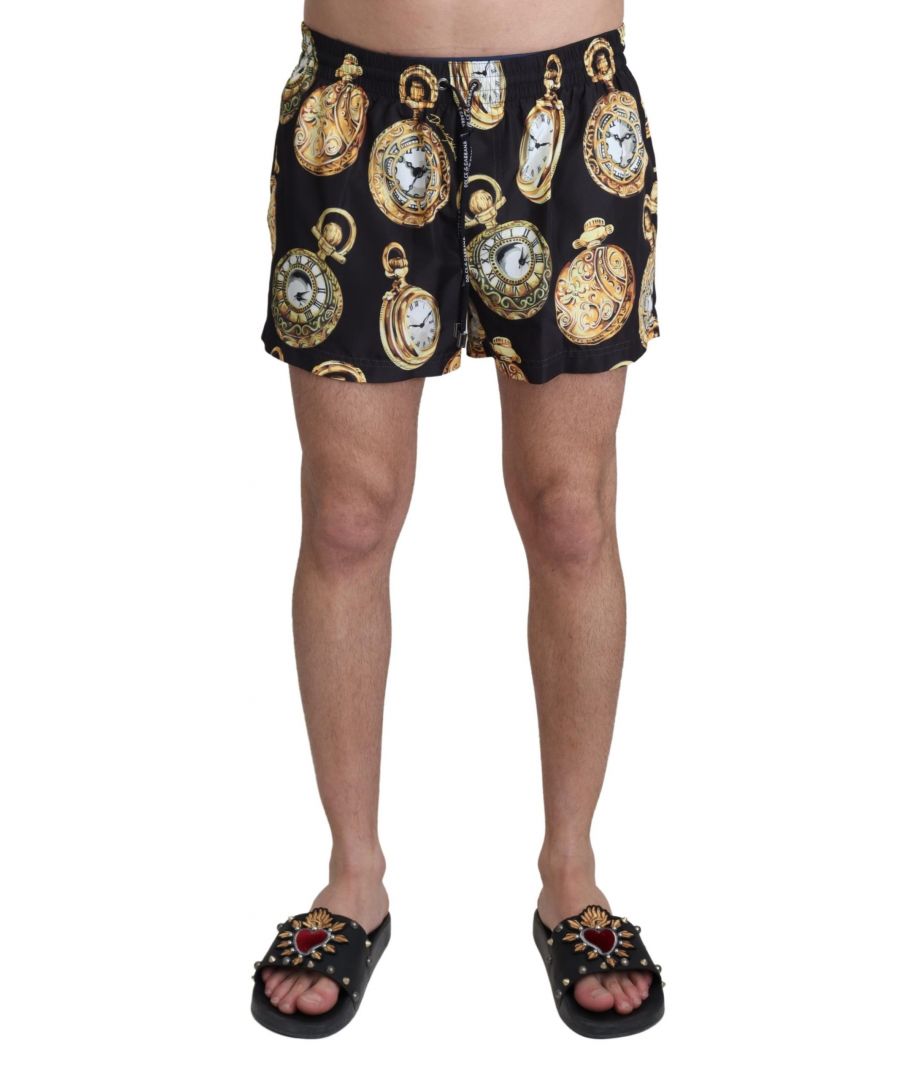 DOLCE & ; GABBANA Gorgeous brand new with tags 100% Authentic Dolce & ; Gabbana beachwear swim shorts trunks Model : Swimshorts trunks Color : Black with gold pocketwatch print Material : 100% Polyester Two front pockets and one back pocket with zipper closure Logo details Great fitting and comfort Made in Italy