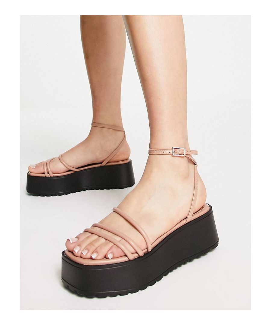 Sandals by ASOS DESIGN Next stop: checkout Strappy design Adjustable ankle strap Pin-buckle Open toe Flatform sole Textured tread  Sold By: Asos