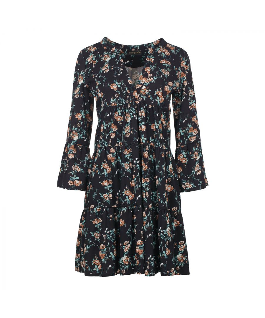 This black floral dress with gathered seams is crafted in  woven viscose fabric. It has ¾ bell sleeves and a round neckline with a 24cm V opening in the front. There is a press stud on the inside at the bottom of the V to prevent it opening too much. There is oblong shaped double fabric below the V opening in the front. The dress has two 24cm wide ruched panels. There is a double pleat in the back. The dress is styled in a loose A line silhouette and hits above the knee.