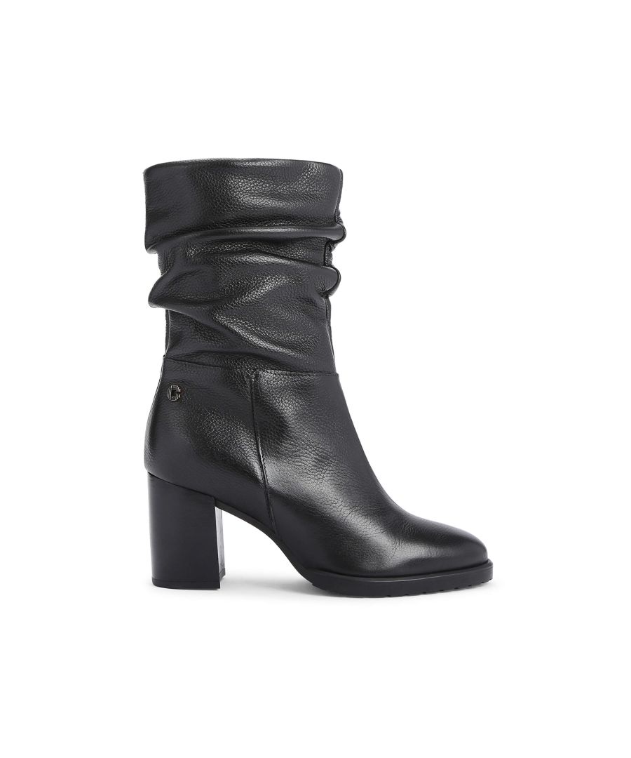 The Turnup ankle boot features a black textured upper in leather. There is a golden metal Icon C pull tab on the inner zip. Heel height: 80mm. This style features ‘All Day Long’ technology. Material: Leather.