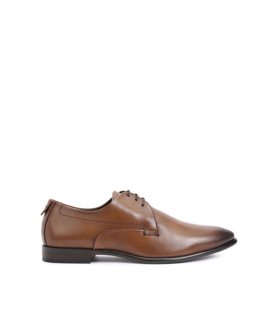 The Stanley is a formal shoe with small lace up detail. The toe is ombre into a darker brown.