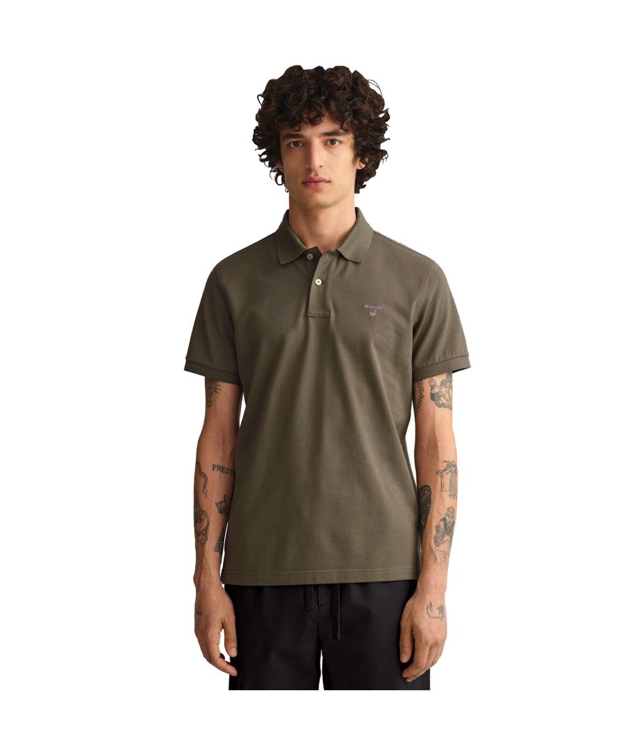 These Original Mens Designer Short Sleeve Gant Polos feature the brands Logo, a Contrasting Trim and a Button-Down Collared Neckline. Crafted With 100% Cotton, these Lightweight and breathable Regular Fit Polos are Suitable for Casual or Workwear.