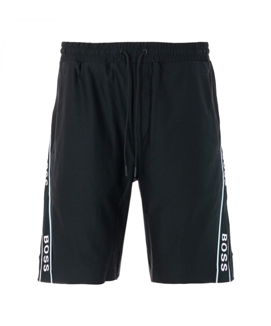 Crafted from an innovative stretch fabric composed of recycled polyester, these versatile track shorts from BOSS boasts dynamic cutlines outlined by contrasting logo tape for statement style. Cut to a slim fit creating a modern silhouette and features an adjustable drawstring waist, side seam pockets and a rear zip pocket. Perfect for a modern sport look. Slim Fit, Stretch Recycled Polyester, Adjustable Drawstring Waist, Side Seam Pockets, Rear Zip Pocket, Contrast Logo Tape Inserts, BOSS Branding. Style & Fit: Slim Fit, Fits True to Size. Composition & Care: 87% Recycled Polyester, 13% Elastane, Machine Wash.
