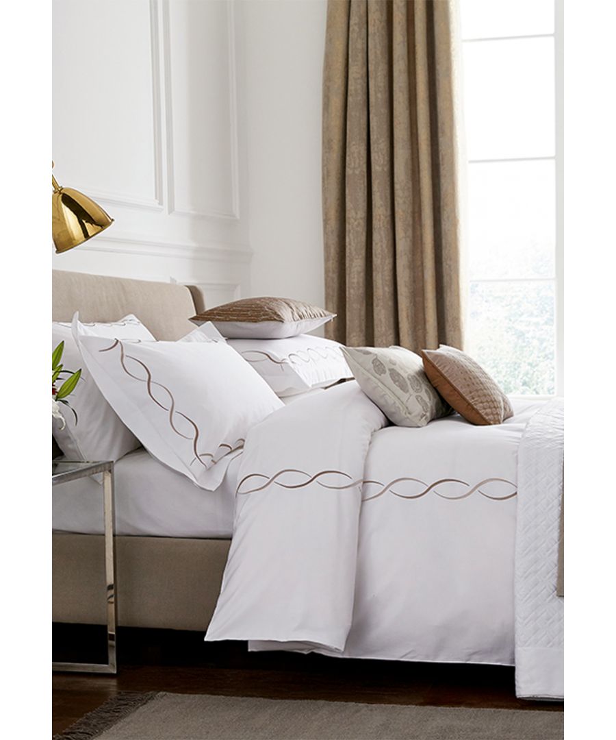Vienne is all about the detail. Smooth 300 thread count cotton sateen is adorned with an elegant swirling embroidered pattern in a palette of soft jade tones or a stylish truffle coloured alternative. Available in single, double, king and super king sizes with oxford, standard and large oxford pillowcases. Add soft, subtle layers to the bed with a selection of the Peacock Blue Hotel accessories in complementary tones. Made in China.