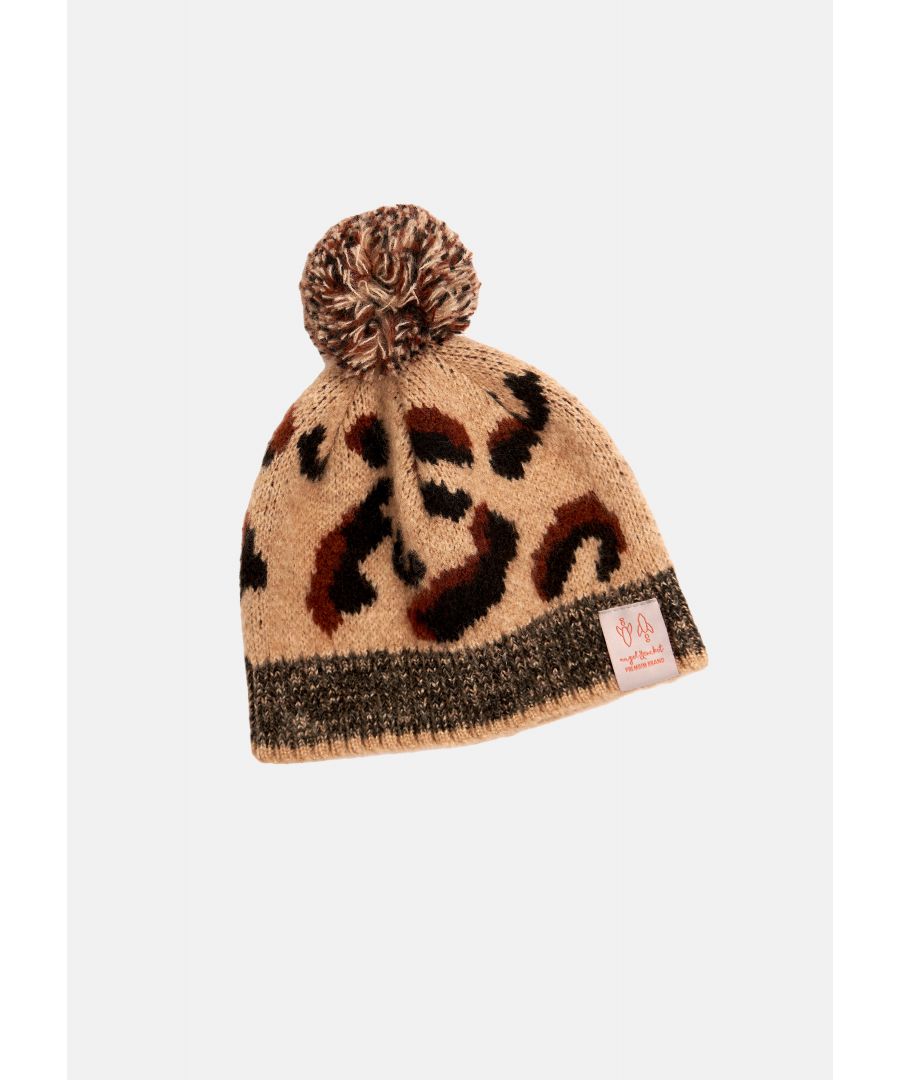 Take a walk on the wild side in this incredible animal print beanie. On a soft ochre colour ground with metallic knit highlights and pom pom. Wear with the Bailey jumper for the ultimate outfit!  Ochre   S/M = 4 - 8 years   M/L = 9-12 years  About me: 80% acrylic 20% polyester.  Angel & Rocket cares - made with recycled polyester  Look after me - Think planet  wash at 30c