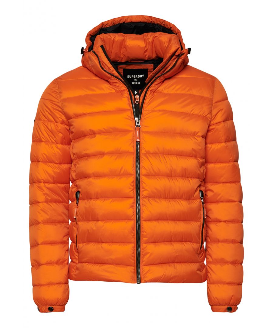 Stay warm in style this season with the Classic Fuji Puffer Jacket, featuring sustainable polyester padding for that classic puffer look.Slim fit – designed to fit closer to the body for a more tailored lookPuffer designDetachable hood with bungee cord adjustmentDouble-layer zip fasteningPopper elasticated cuffsTwo front zip pocketsBungee cord hemRecycled paddingFully linedInternal mesh pocketSignature logo badgeThe padding in this jacket is made using up to 100% recycled materials. Each jacket contains between 5 and 48 recycled bottles, depending on the weight and amount of fill used, saving waste being sent to landfill or polluting our oceans. 