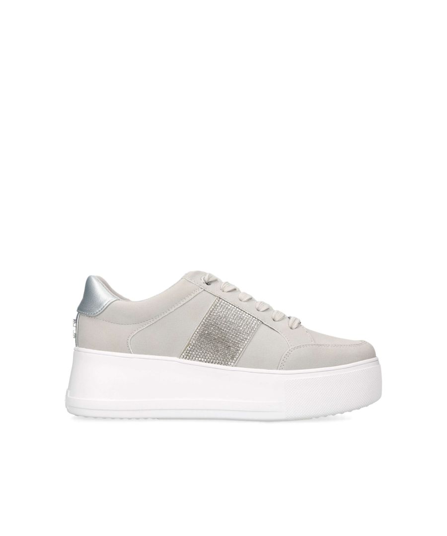 The Jive Lace Up is a flatform trainer in a grey microsuede, the front laces up. The back of the heel has a metallic grey panel and features an Icon C stud in silver.