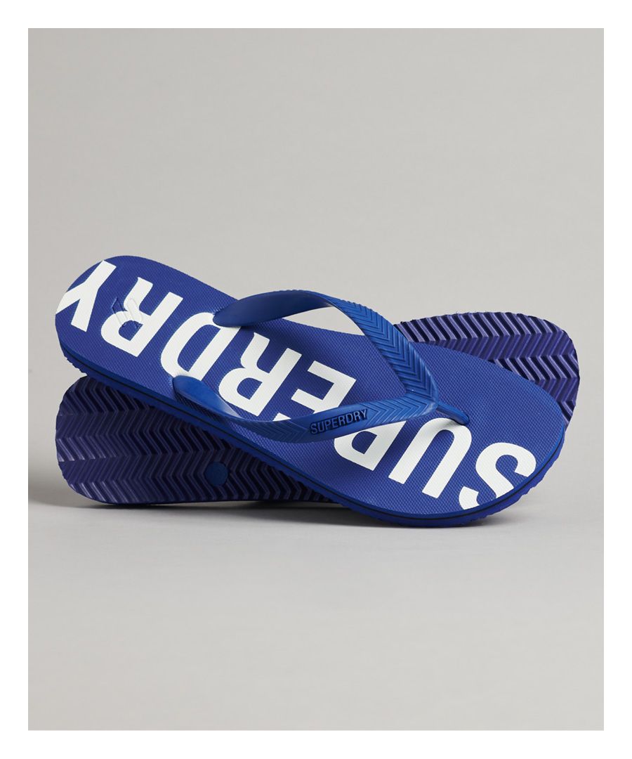 When it comes to beach weather, a bright pair of flip flops are a perfect pick. They're a bold style for those sunny days and are sure to help you stand out from the crowd.Rubber foot strapEmbossed Superdry logoBranded soleDebossed Code logo