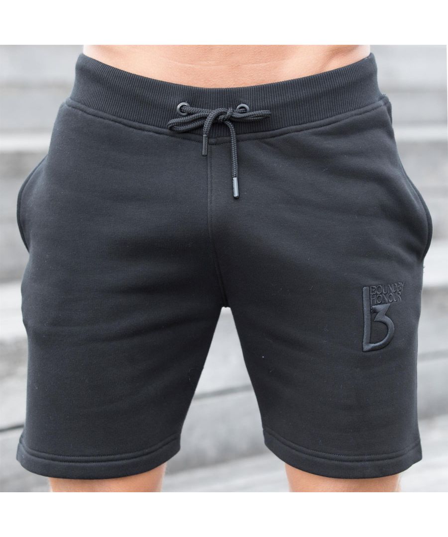 Mens Bound By Honour Designer Fleece Sweat Shorts. Features Two Front Side Pockets with Bound By Honour Logo Embroidery on Left Side. Elasticated Ribbed Waist with Drawstrings. Ideal for Casual and Gym Wear.