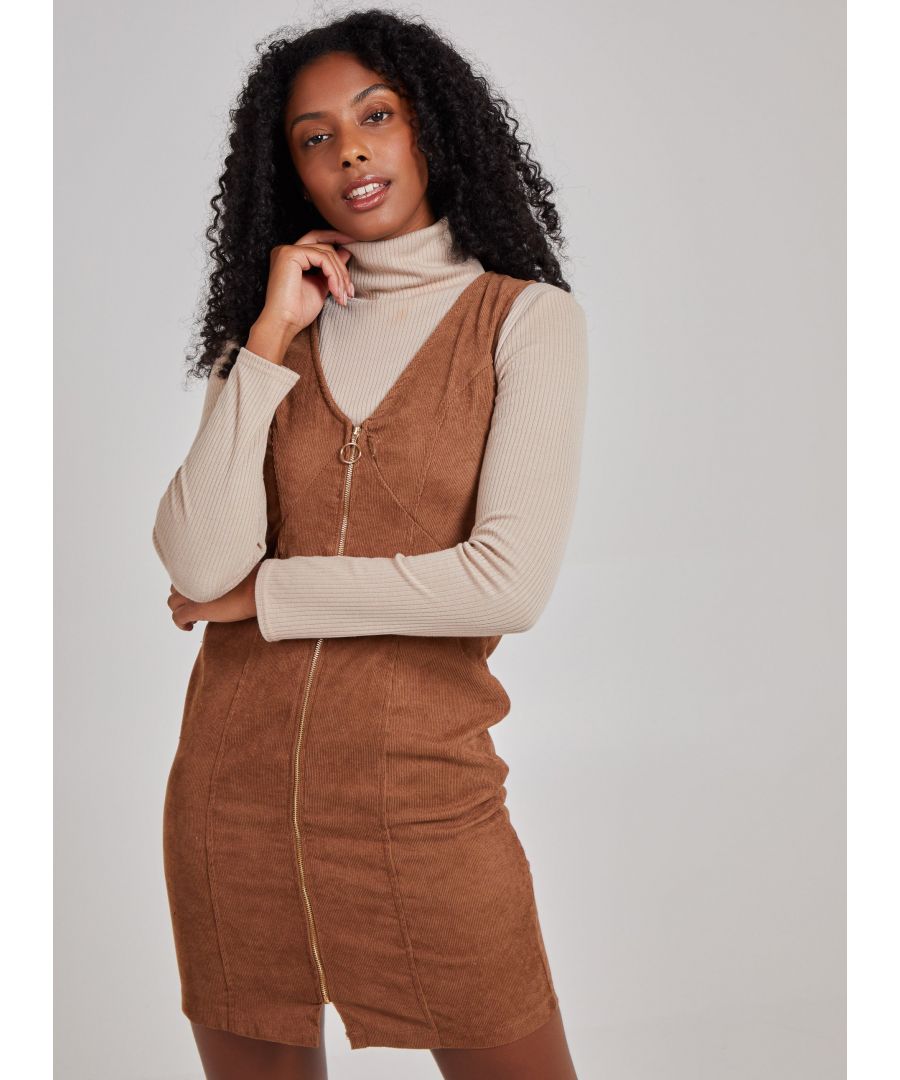 Look cute in corduroy in time for Spring! This zip front dress can be layered up or down, making it a perfect dress season after season!\n100% Polyester Hand Wash Dry Flat Do Not Iron Model wearing size 8 Model height: 173cm / 5'8
