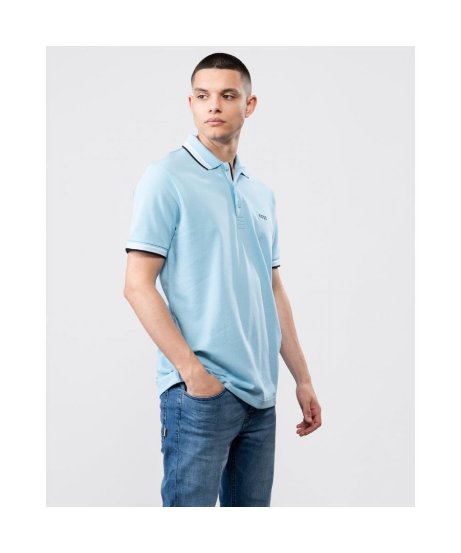 A signature polo shirt by BOSS Menswear, cut to a regular fit. Featuring contrast tipping and a logo at the left chest, this short-sleeved polo shirt is designed in cotton piqué and detailed with further BOSS branding at the undercollar.\nRegular fitFlat-knit collarNumber of buttons: 3Short sleevesFlat-knit cuffsStandard length\n100% Cotton\n50469055\nModel is 5