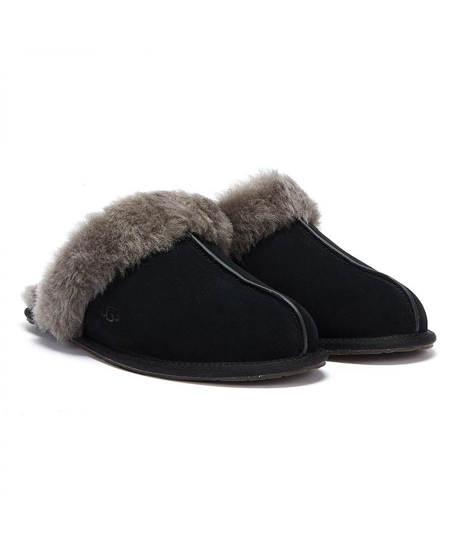The Scuffette II is a revamped version of a popular UGG slipper. Comes in a suede upper with a plush sheepskin collar. The interior is lined in sheepskin with a wool insole. The clear rubber sole pads are cork-infused.\n\n• Water-resistant Silkee suede\n\n• UGGpure™ wool insole\n\n• Nylon binding
