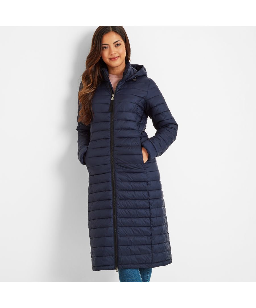 Wearing our Oldstead womens extra-long quilted puffer jacket is like being wrapped up in a super warm and cosy, yet lightweight, duvet. This streamlined coat is quilted in a buttery soft, lightweight fabric with flattering narrow, stitched baffles and has a high-performance thermal filling made from recycled plastic bottles, giving warmth without adding bulk. It’s also easy to slip on and off thanks to a chunky two-way zip. Designed by our team in West Yorkshire in colours inspired by the moorland that surrounds us, Oldstead is wind resistant and has toggle adjusters at the hood and elasticated cuffs to keep the wind out and the heat locked in. There is also a supersoft padded inner collar that will keep your neck warm, even when the hood is down. Premium finishing touches include two good sized lower zip up pockets for your valuables and our signature embossed rubber TOG24 Rose badge on the sleeve.