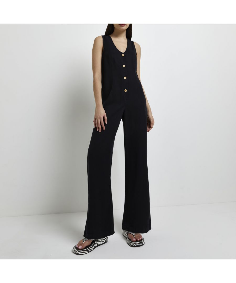 > Brand: River Island> Department: Women> Material: Lyocell> Material Composition: 100% Lyocell> Type: One-Piece> Style: Jumpsuit> Size Type: Regular> Fit: Regular> Neckline: V-Neck> Sleeve Length: Sleeveless> Leg Style: Wide-Leg> Pattern: No Pattern> Occasion: Casual> Selection: Womenswear> Season: SS22