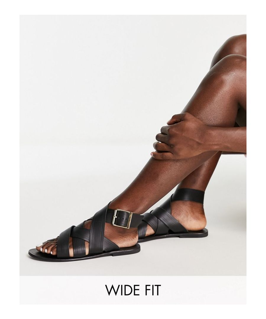 Sandals by ASOS DESIGN Free your feet Adjustable ankle strap Pin-buckle fastening Toe loop Flat sole Wide fit  Sold By: Asos