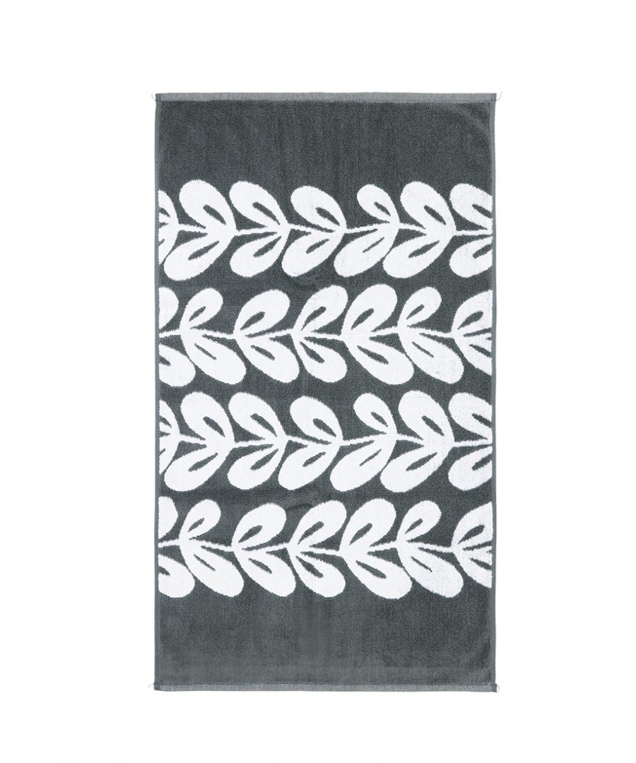 A statement bathmat for the modern bathroom. Stems of repeating Scandi leaves in white flow across a graphite base. A jacquard style terry weave mat in 100% cotton, completed with a hem on all four sides.