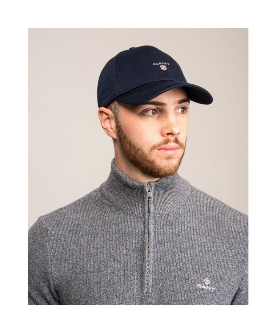 This 100% cotton cap is a necessary, sporty addition to any active man's wardrobe. Pair with preppy chinos and an easy T-shirt for an athletic, cool look.\n\nGANT logo embroidery at centre front\nAdjustable strap and buckle closure at back\n\nCotton 100%