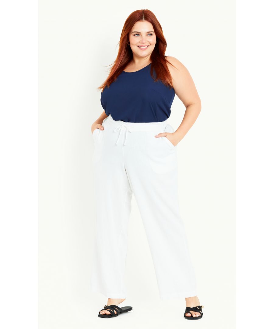 Keep your summer rotation on fleek with the oh-so breezy and versatile Relaxed Linen Blend Trouser! This stylish pair features an elasticated high waist cut, relaxed leg and convenient pockets, perfect for day-to-day wear. Key Features Include: - Elasticated waist with drawstring - Four pockets - Linen blend fabrication - Relaxed leg - Unlined - Pull up style - Ankle length Elevate your day look with a V-neck tee and some chic wedges.