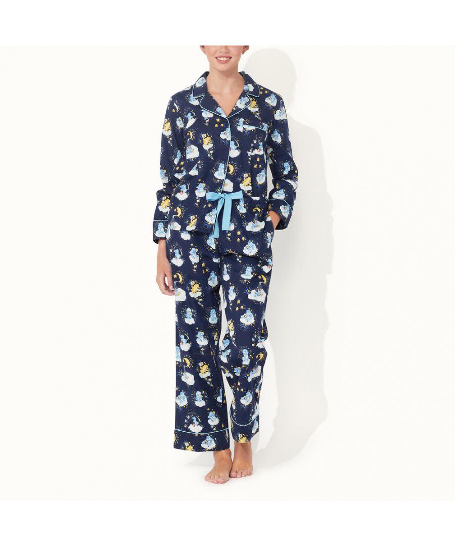 Add a little nostalgic fun to bedtime with our limited-edition Care Bears Long Woven PJ Set. \nThese classic cut pyjamas are made in a traditional style that's gently tailored for a comfortablet fit, in cool, breathable cotton. The bottoms have hip pockets and an elasticated waist for comfort, while the top has matching buttons and a patch pocket. Both have a piping trim and are decorated with our adorable Bedtime Bear print, it features Bedtime Bear and his friends set against a navy blue starry sky, busy preparing for a blissful night's sleep.