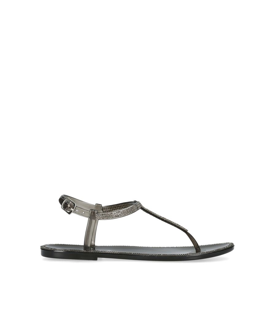 Carvela's Sparkle is a rubber sandal in black. The t-post strap is embellished with crystals corresponding with the edge of the footbed. The ankle strap is fastened with silver tone buckle.