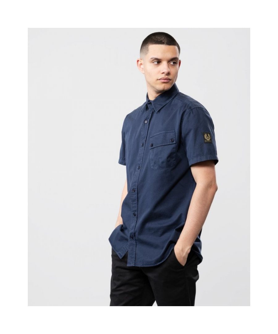 A structured cotton-twill shirt with a distinctive angled pocket, logo sleeve patch and gently faded finish.Tilted chest pocket with button flapAdjustable button cuffButton frontEmbroidered-edge Phoenix patch on sleeve100% Cotton 