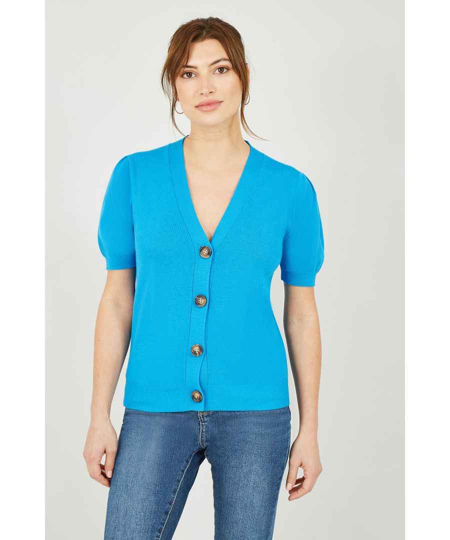 Stock up on short sleeve essentials with this stunning Yumi Blue Short Sleeve Knitted Cardigan. Perfect for layering, this knitwear staple come in a striking bright blue, with subtle vertical ribbing, balloon sleeve style short sleeves and tortoiseshell button fastenings.