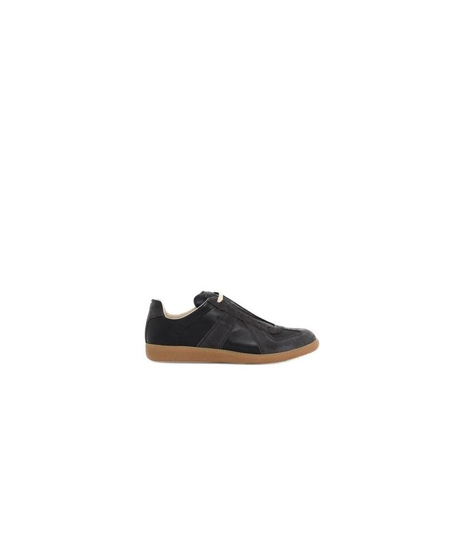These Maison Margiela Trainers are in a black colour-way and the style of the trainer is suede and textile upper, tonal stitching, gum mid sole, flat laces and branding to the tongue to complete.