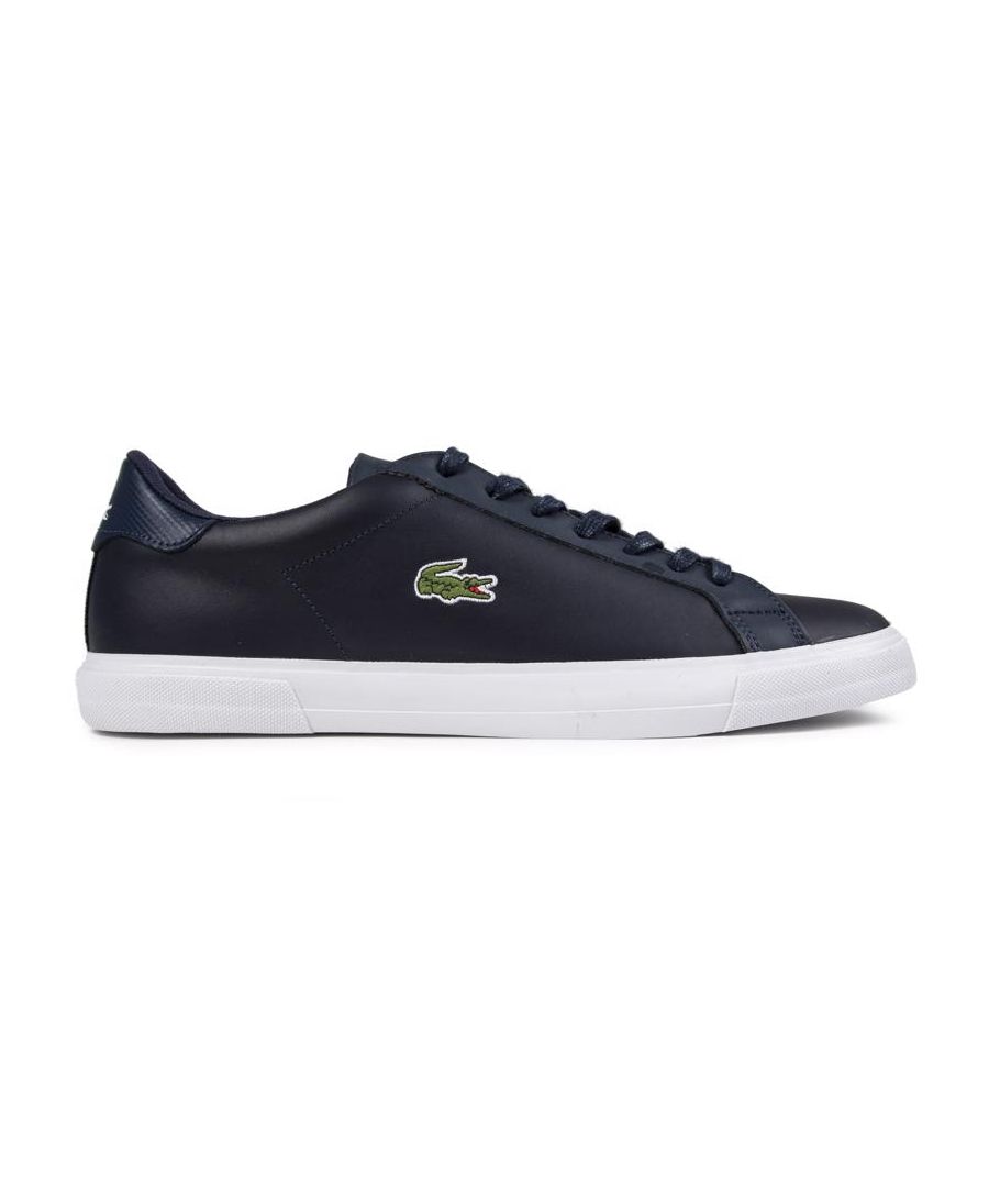 Men's Navy Lacoste Lerond Plus Lace-up Monochrome Trainers With Premium Leather Uppers Featuring Embroidered Iconic Croc Logo, And Branding In White To Tongue And Heel. These Court Style Pumps Have Blind Eyelets Giving A Sleek Appearance And Classic White Rubber Vulcanised Sole