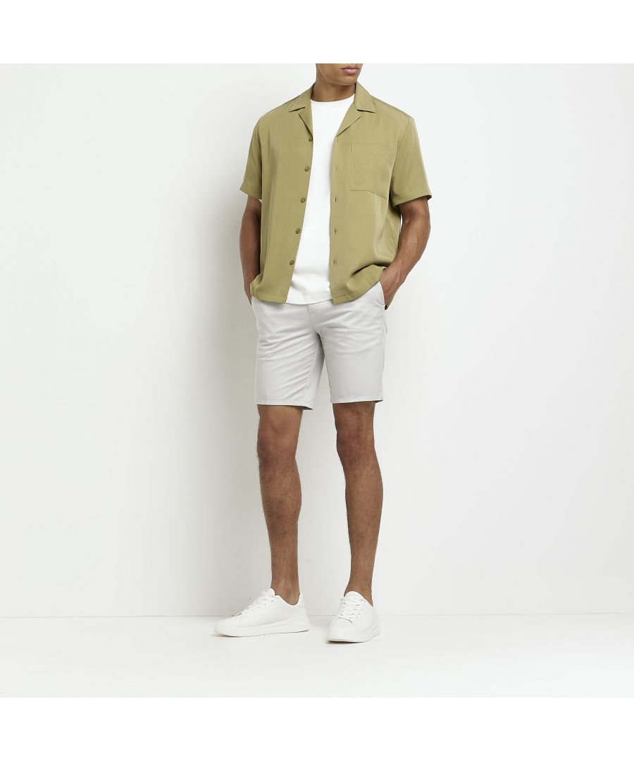 > Brand: River Island> Department: Men> Material: Cotton Blend> Material Composition: 98% Cotton 2% Elastane> Style: Chino> Size Type: Regular> Fit: Slim> Occasion: Casual> Season: SS20> Pattern: No Pattern> Closure: Button> Front Type: Flat Front