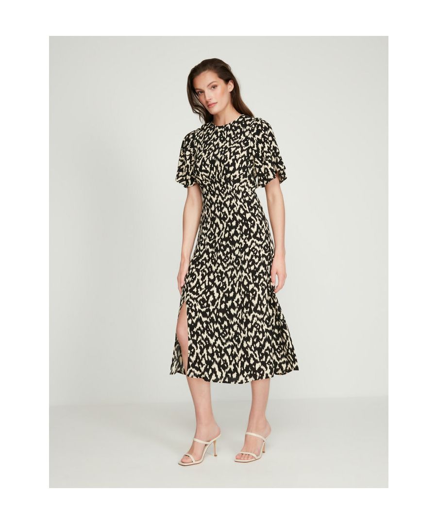 Elevate your wardrobe for the new season with this statement dress from Sonder Studio. This dress is cut to a midi length and features an ikat animal print, short sleeves and a round neckline. Style with a denim jacket to create an off-duty look or add your favorite heels for a touch of glamour.
