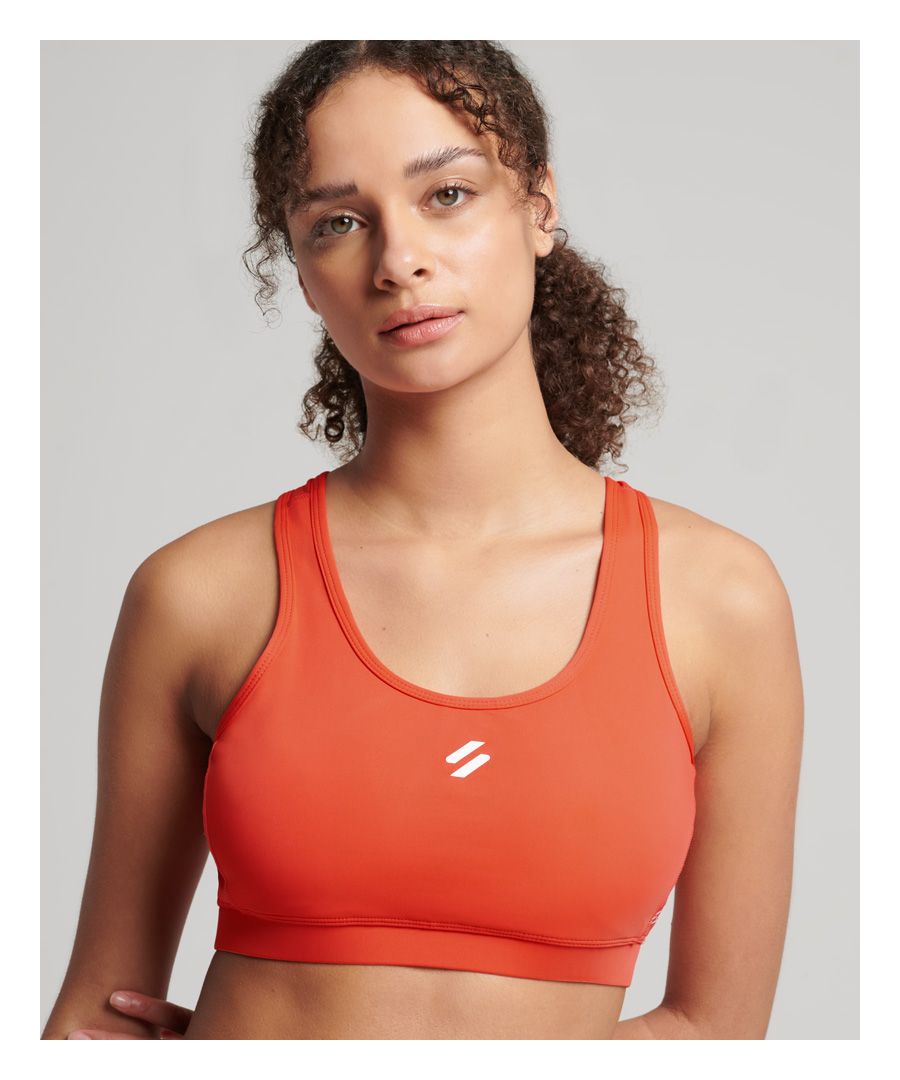 For when you want to push yourself without the fuss, our core mid impact bra has got you covered. Featuring subtle branding to maintain that classic athleisurewear look, it's sure to maximise your comfort and performance thanks to our innovative fabric technology for breathability and luxurious fit.Mid impactRemovable cupsElasticated bandCross over back strapsKeyholePrinted brandingBreathable fabric - Allows air and moisture to pass through the material to help keep you comfortableMoisture-wicking - Helps to regulate your body temperature by drawing perspiration away from the body and allowing moisture to disperse from the outer face of the fabric