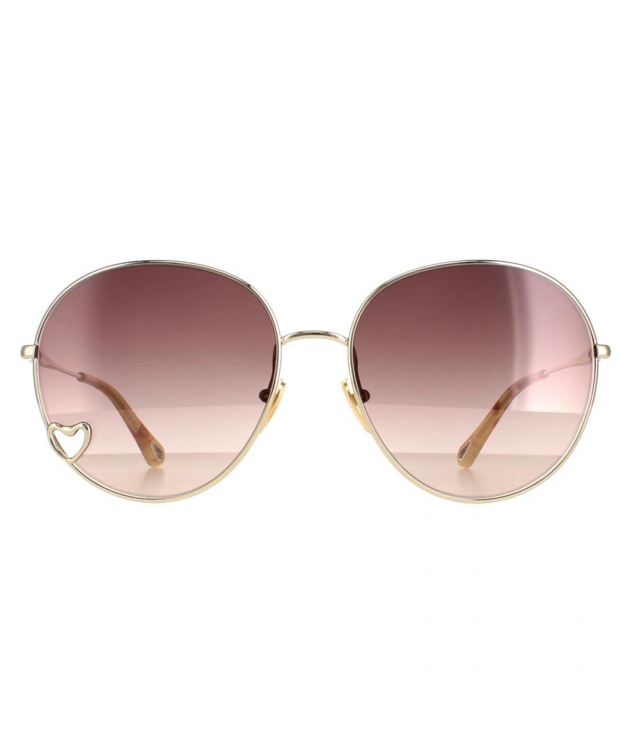 Chloe Round Womens Gold Brown Gradient CH0027S  Sunglasses are a gorgeous round style crafted from lightweight metal. The silicone nose pads ensure all day comfort while Chloe's logo features on the inside of the temples tips for authenticity.